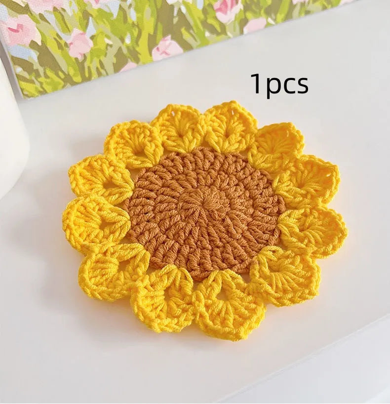 Hand-woven wool flower coasters showing floral pattern texture and natural wool material
