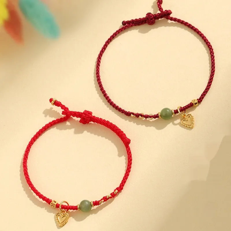 Handmade women's bracelet woven from 925 silver and red Hetian jade with carrying strap.