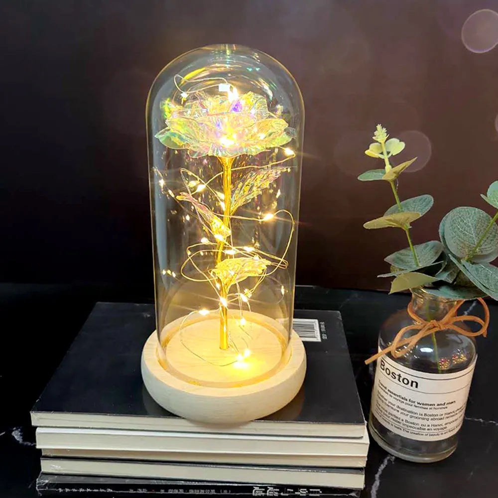 Artificial silk rose LED ornament with glass lampshade showing warm white lights, available in multiple colours.