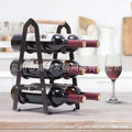 Black iron metallic desktop wine rack holding one wine bottle on a kitchen countertop