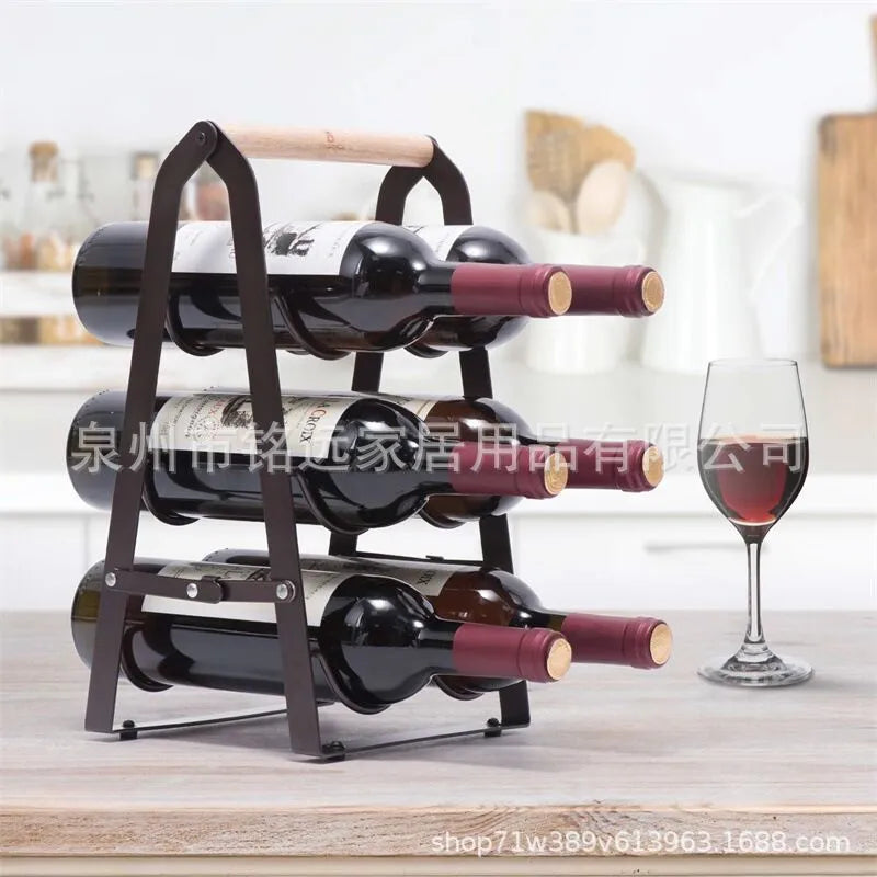 Black iron metallic desktop wine rack holding one wine bottle on a kitchen countertop
