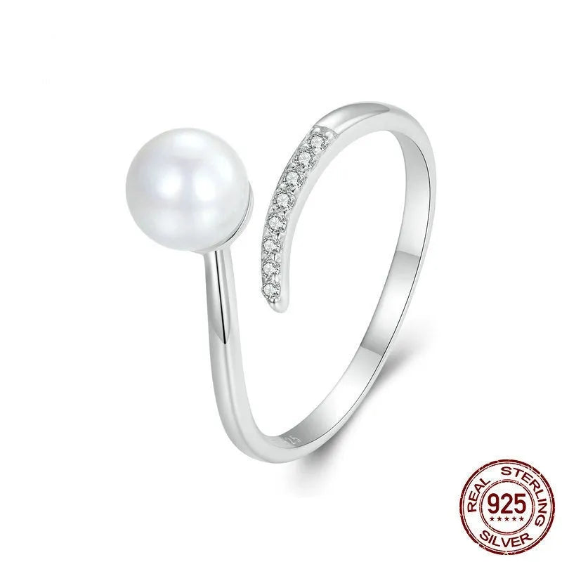 S925 sterling silver adjustable open loop ring with a natural shell pearl.