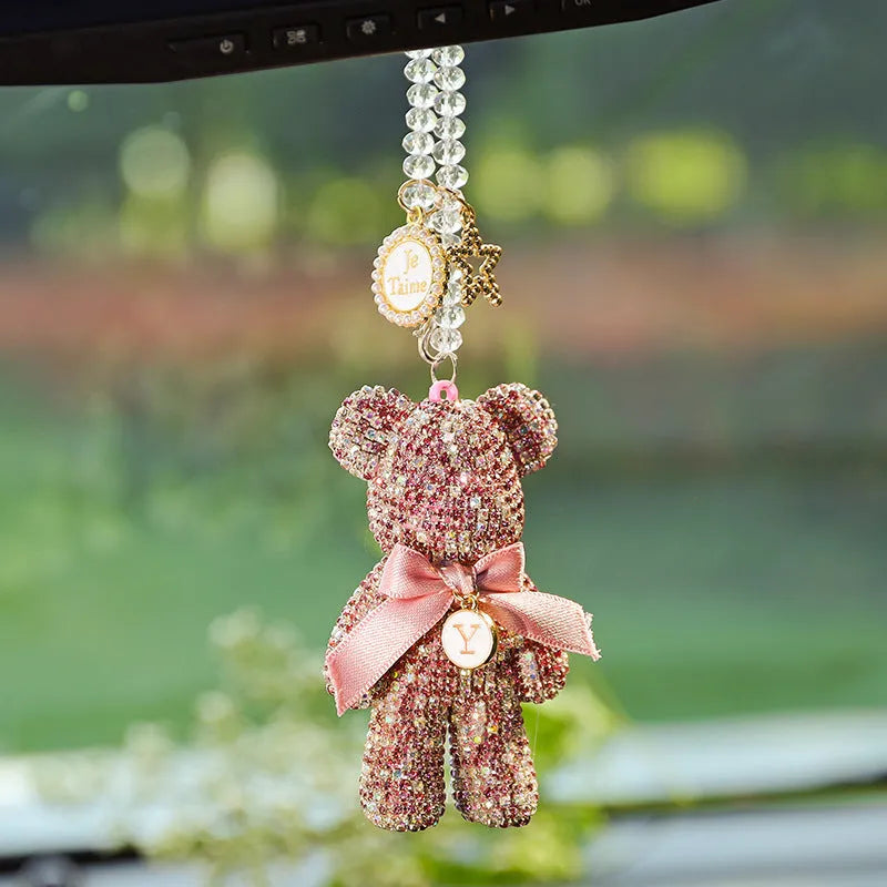 Crystal rhinestone Violent Bear car rearview mirror pendant in black, white, and mixed pastel colours.