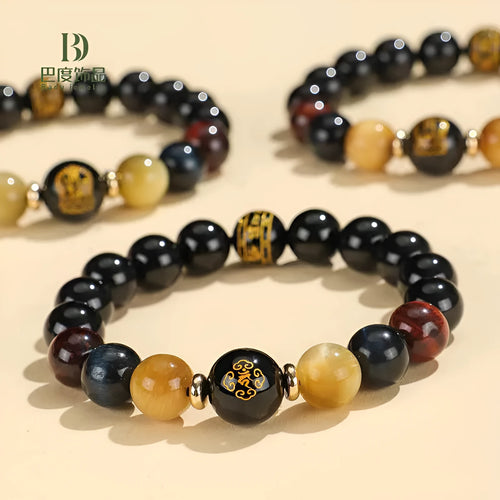Handmade black agate beaded bracelet with Buddhist carving and tiger eye gemstones
