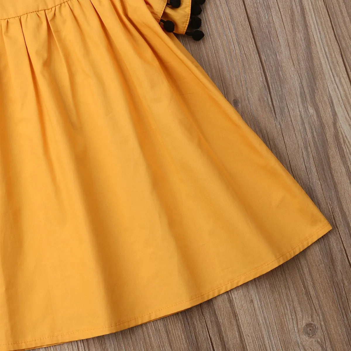 Sleeveless orange cotton girls dress for toddlers and children sizes 12M to 5T