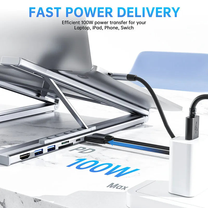 Grey aluminium alloy laptop docking station with folding stand and multiple ports