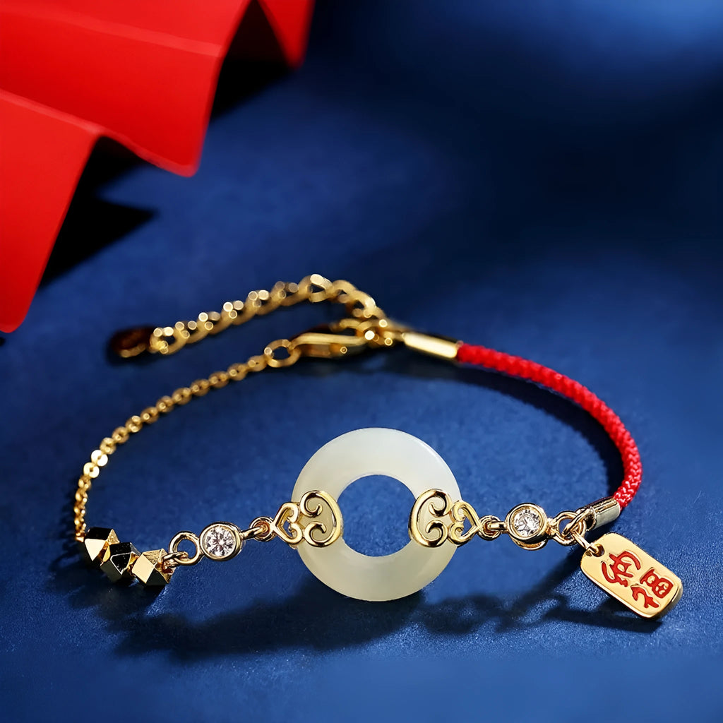 Women's sterling silver jewellery set with gourd bracelet, Fu necklace, and earrings featuring inlaid Hetian jade.