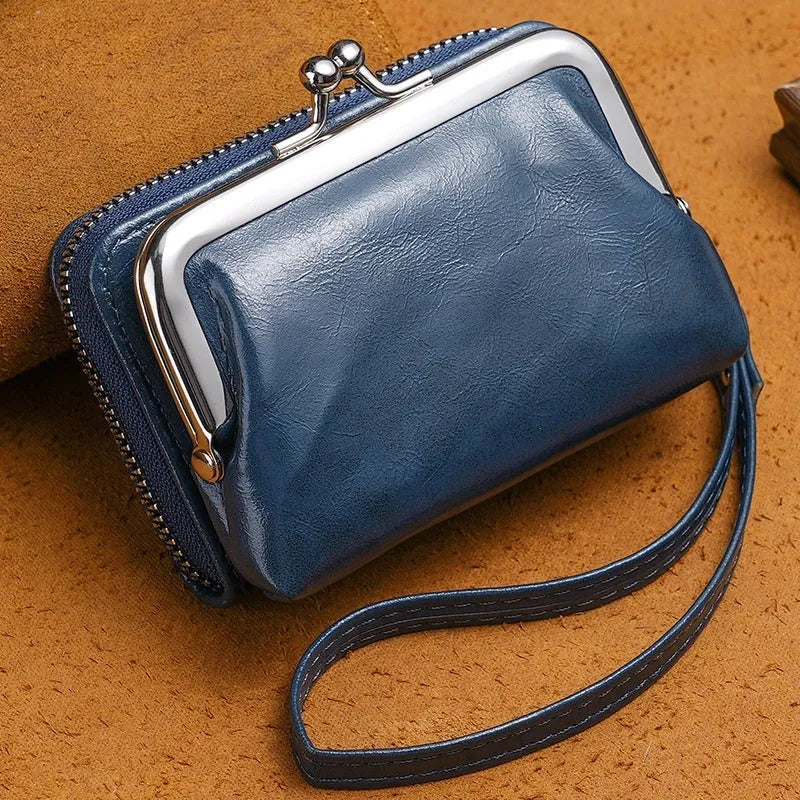 Ladies' leather-look coin purse with a 4-inch metal clip and zip closure in five colour options.