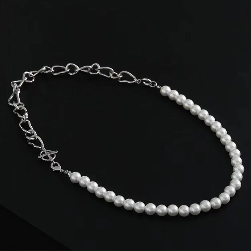White acrylic geometric asymmetric pendant on a twisted chain, a clavicle-length necklace.