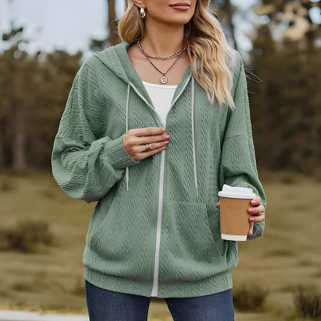 Green women's hooded zip-up coat with loose fit and long sleeves