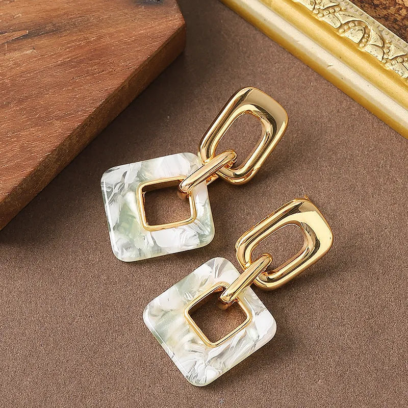 Hollow geometric square earrings with chamfered pattern in electroplated copper