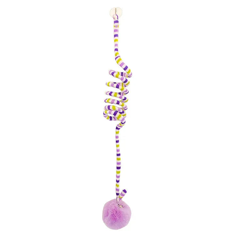 Colourful spring-mounted cat toy with an inflatable ball and bell, shown with a suction cup for hanging.