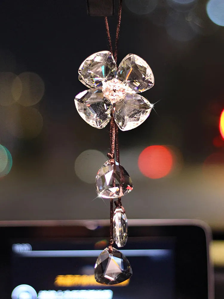 Crystal Four Leaf Grass car pendant hanging, showing its approximately 20cm size and transparent finish.