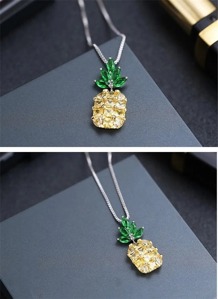 Silver geometric pineapple diamond necklace on white background