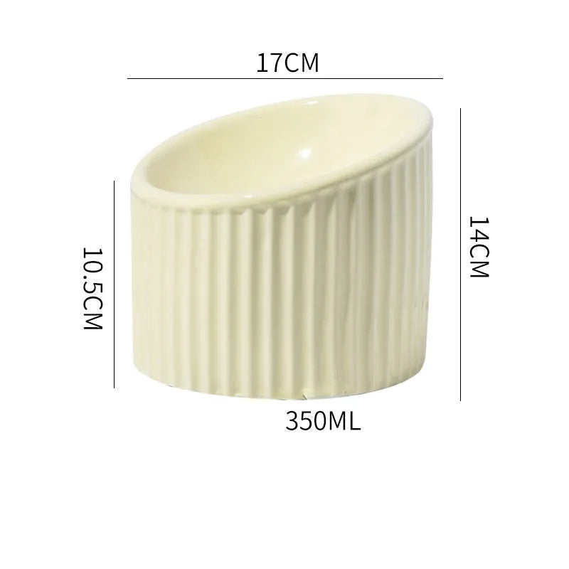 Ceramic elevated cat bowl in green colour with tilted round design for comfortable feeding.