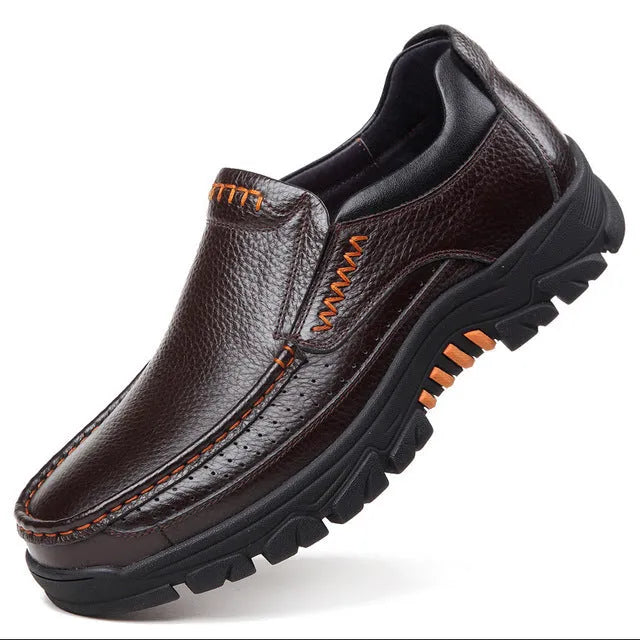 Men's black and brown business casual slip-on shoes made from cowhide leather with rubber soles.