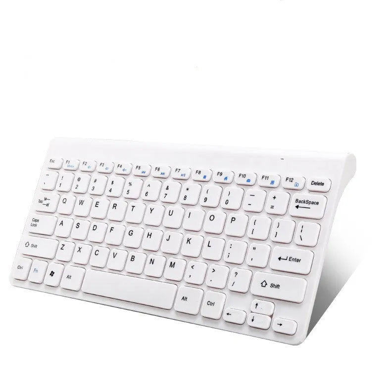 Black wireless keyboard and mouse set with 4G USB receiver on wooden desk