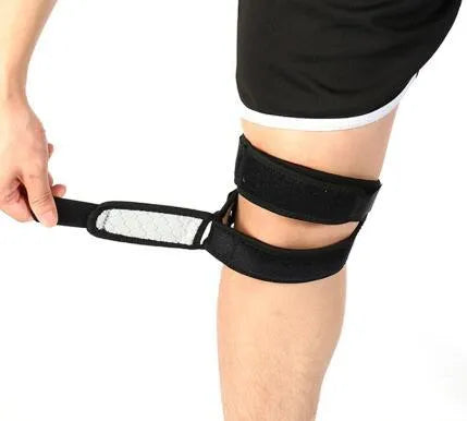 Professional patella band knee support in black with shock absorbing EVA pad and breathable rear perforations