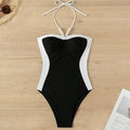 Black and white women's one-piece swimsuit with pearl spaghetti straps and slim-fitting design