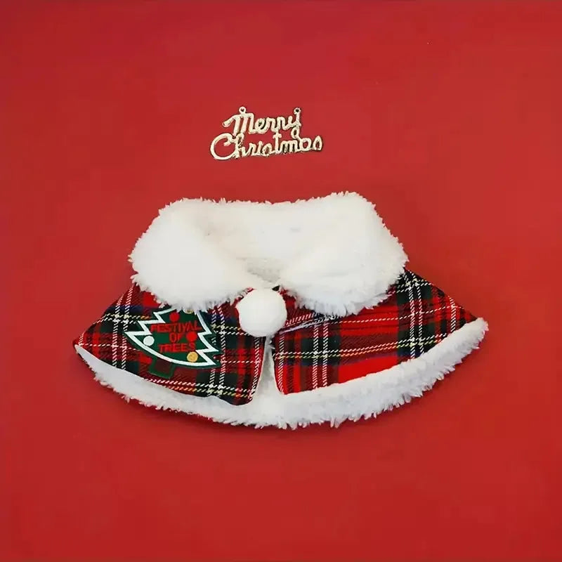A red festive pet scarf with a bell pattern fastened around a dog's neck with an elastic collar.