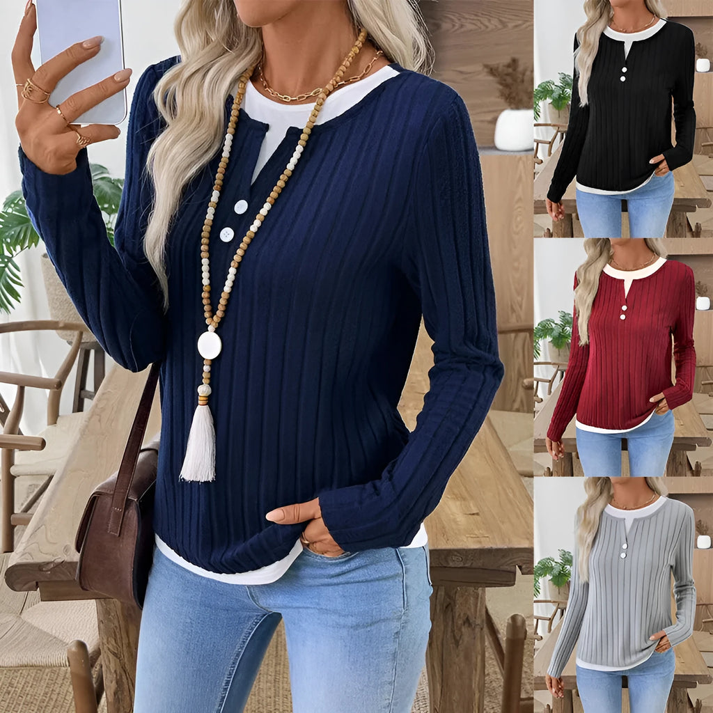 Women's black two-piece style pullover sweater with round neck and button detail on long sleeves.
