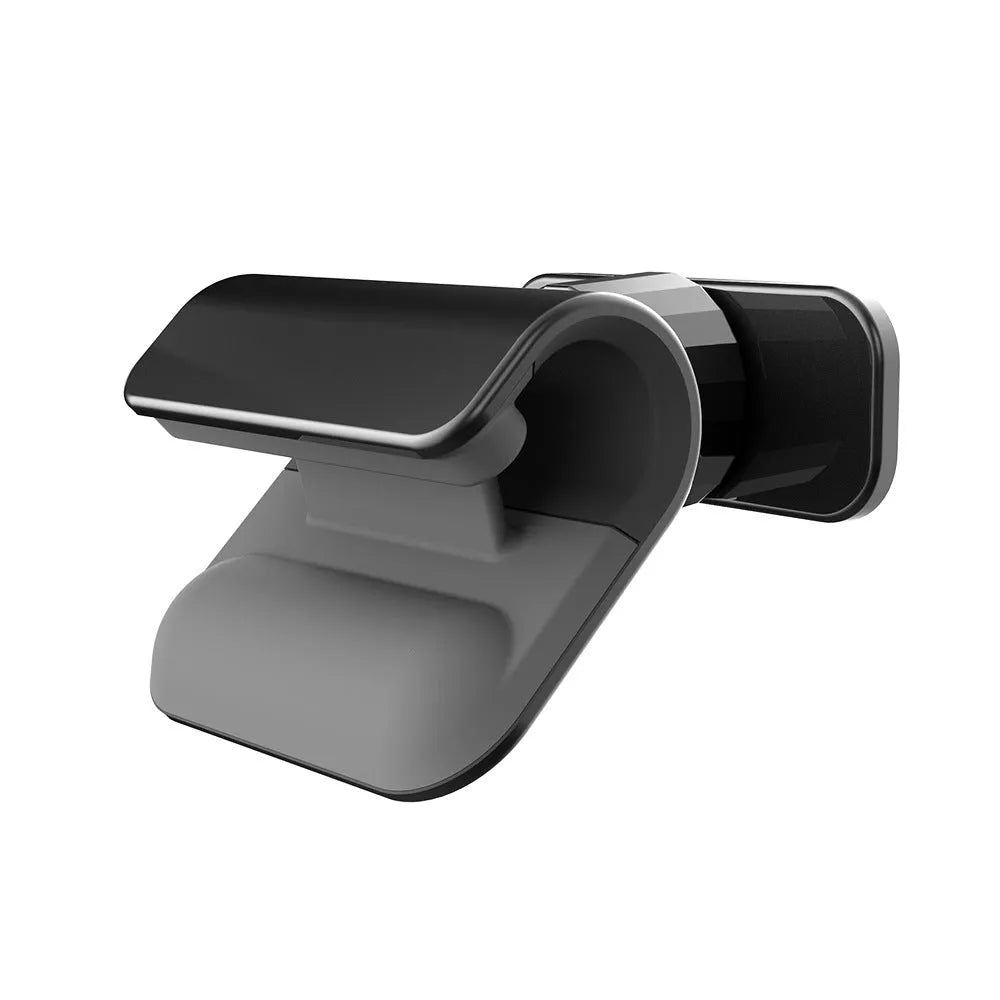 Universal gravity car phone holder with 360-degree rotation, black ABS plastic, mounted on dashboard with phone in portrait mode