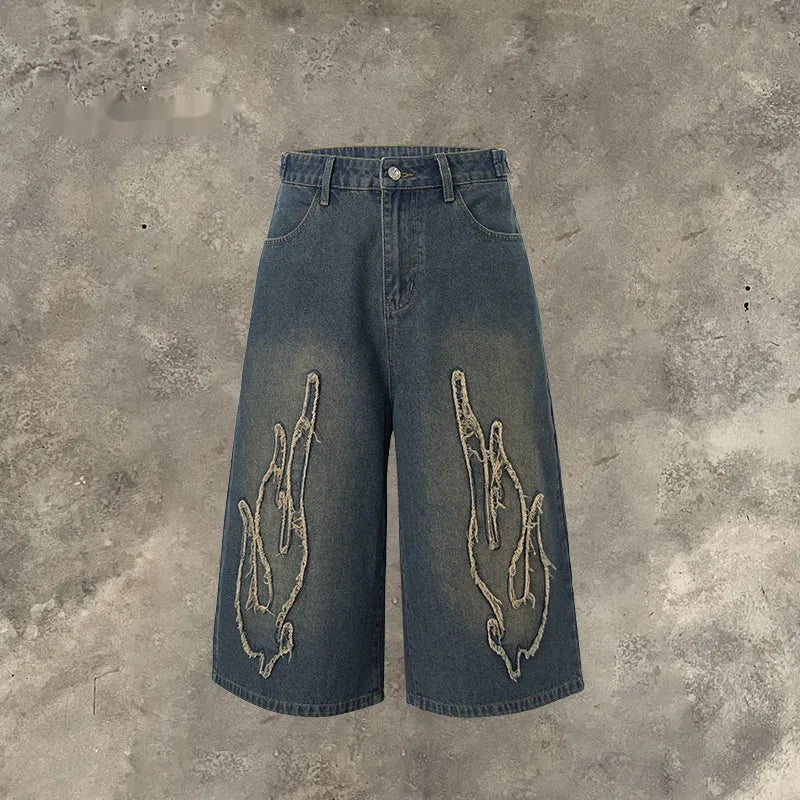 Men's black denim shorts with flame embroidery patch, cropped straight leg style
