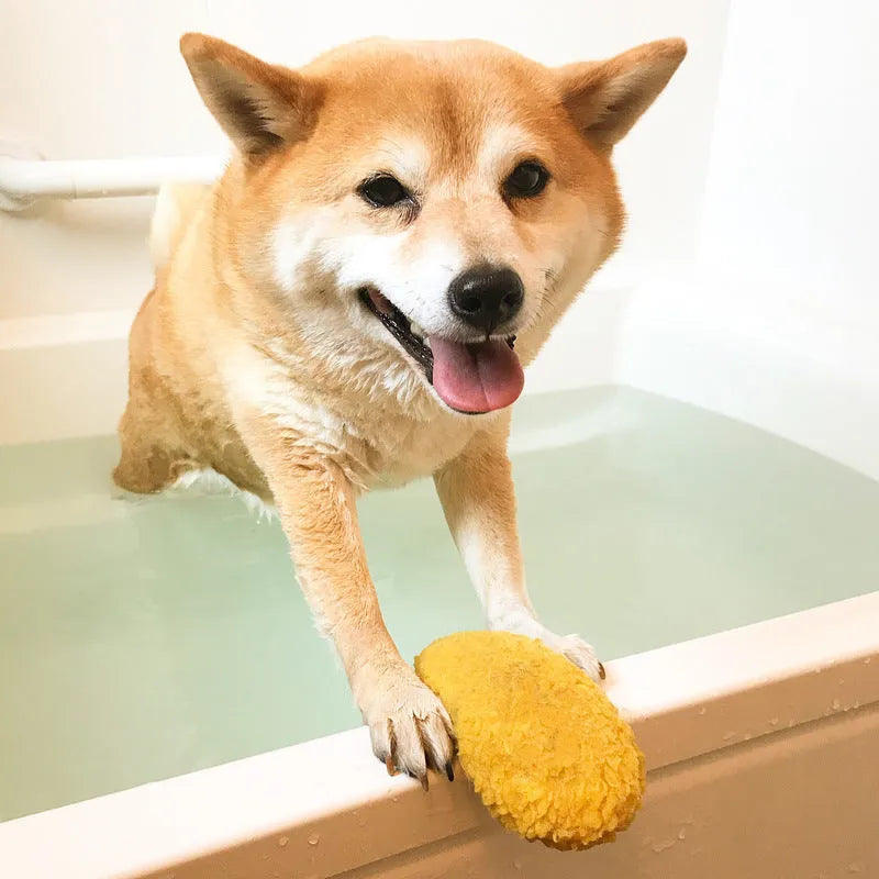 Yellow plush fried shrimp tempura squeaky dog toy with built-in squeaker