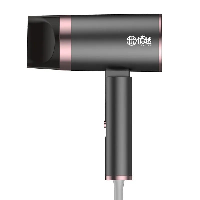 Foldable negative ion hair dryer in emerald green colour with foldable handle and single nozzle