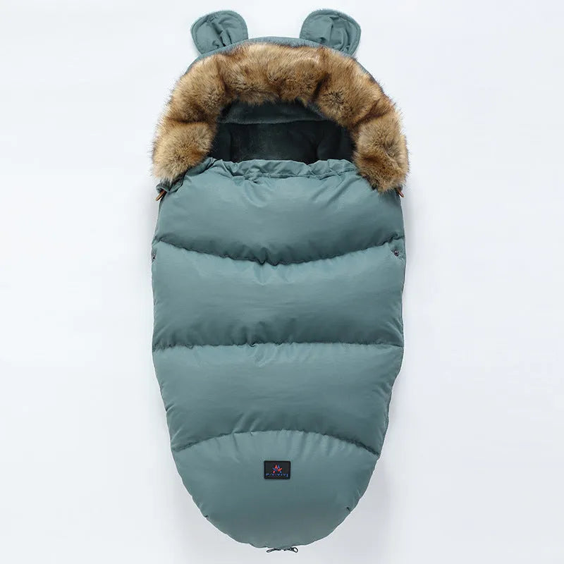 Convertible baby sleeping bag cocoon in a pram, showing cotton blend fabric and flannel lining.