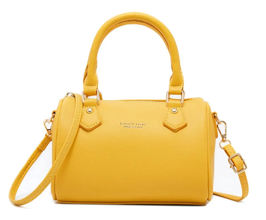 Ladies diagonal pillow crossbody bag in PU fabric with letter print in yellow colour