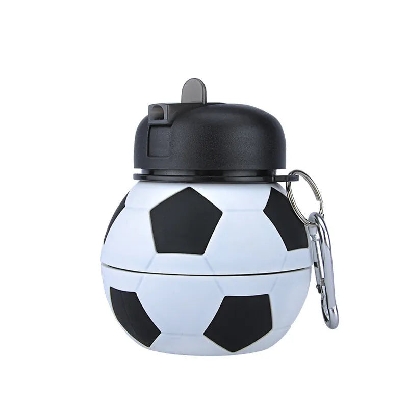White collapsible soccer ball silicone water bottle with straw and black carrying clip on white background