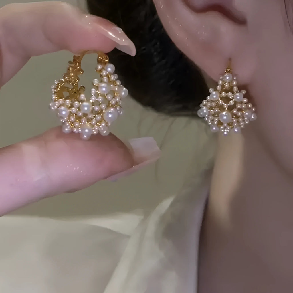 Gold floral basket earrings with pearl inlay and rice-shaped bead construction