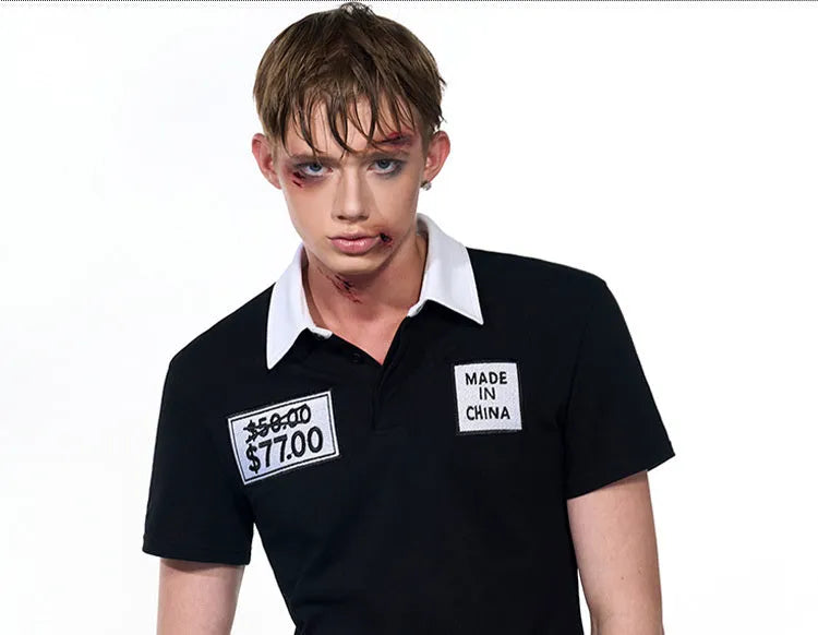 Black slim fit men's polo collar short sleeve T-shirt with embroidery detail on front.