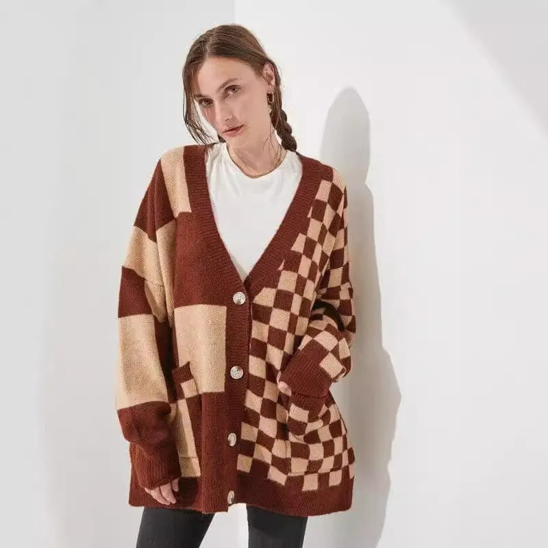 Loose fit knitwear cardigan with checks print in a selection of colours on a hanger.