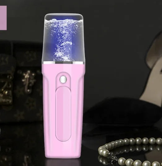 Pink handy nano mist sprayer with 26ml water tank and 2200mAh power bank on white background