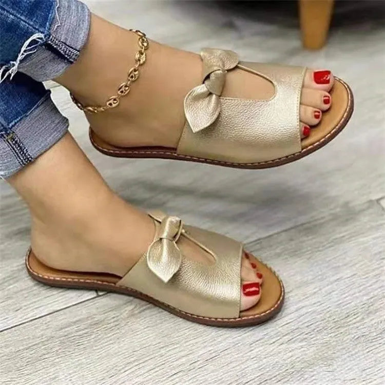 Ladies fish mouth sandals with a bow decoration in black, pink, or gold colours