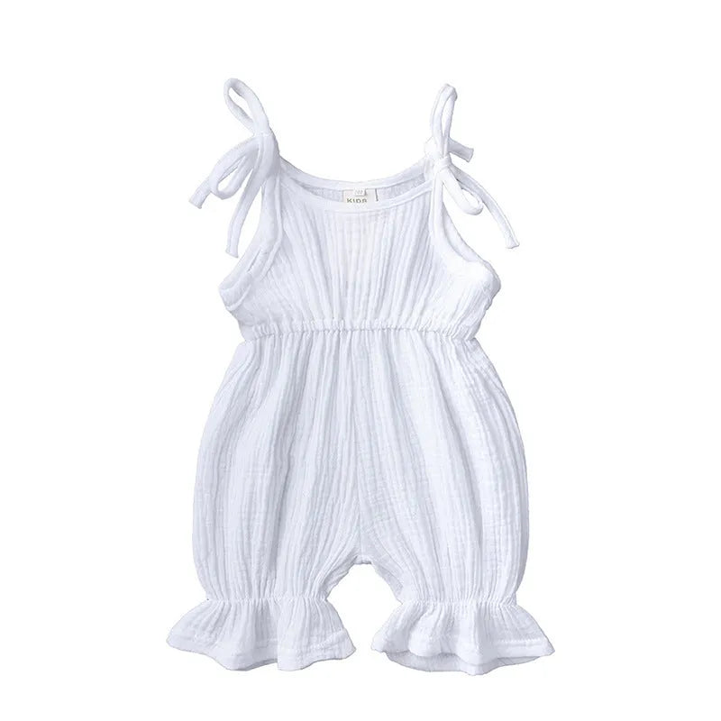 Baby girls sleeveless solid cotton romper jumpsuit in pink, front view