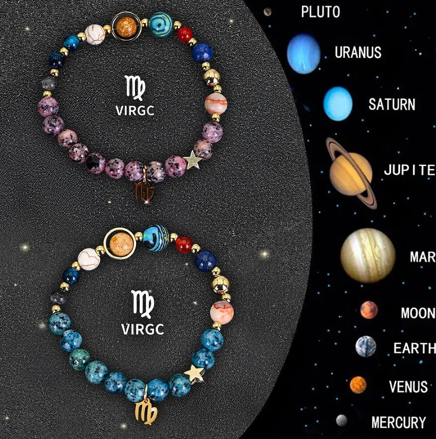 Two natural stone beaded bracelets with zodiac charms on a table.