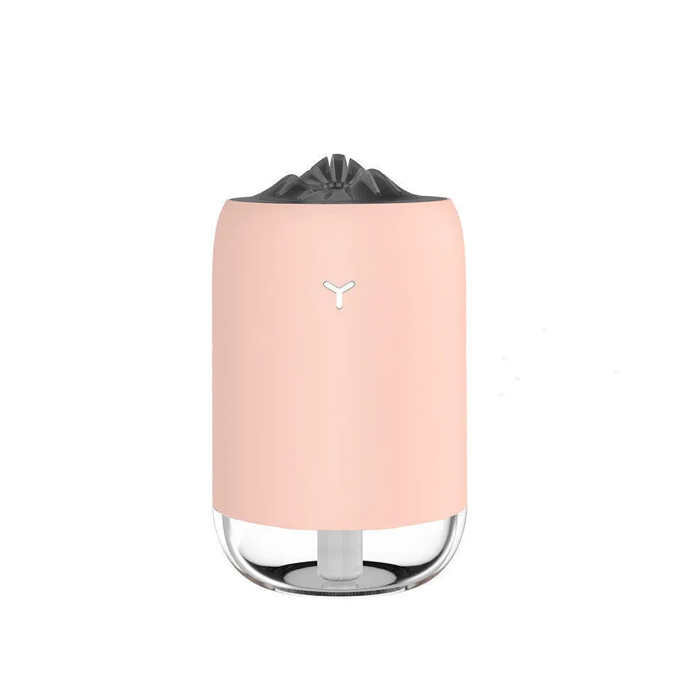 Mini cylindrical USB humidifier in green, pink, or white with 260ml water tank