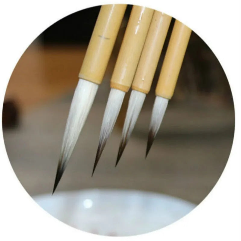 Set of four gold-coloured calligraphy brushes with wolf wool thread and mixed hair tips.