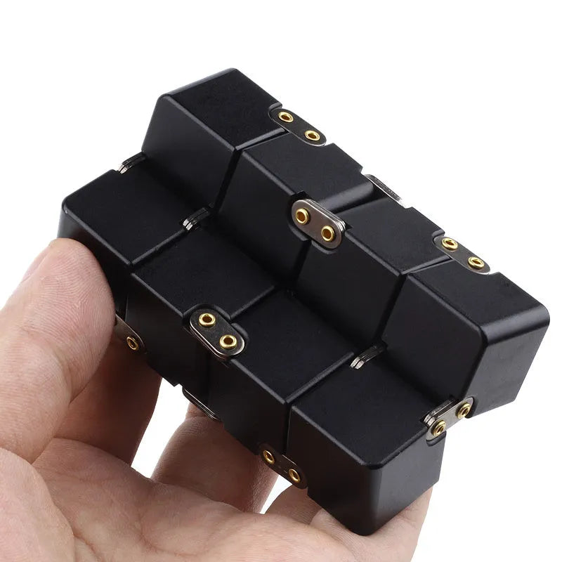 Black zinc alloy infinity cube fidget toy showing eight connected cubes.
