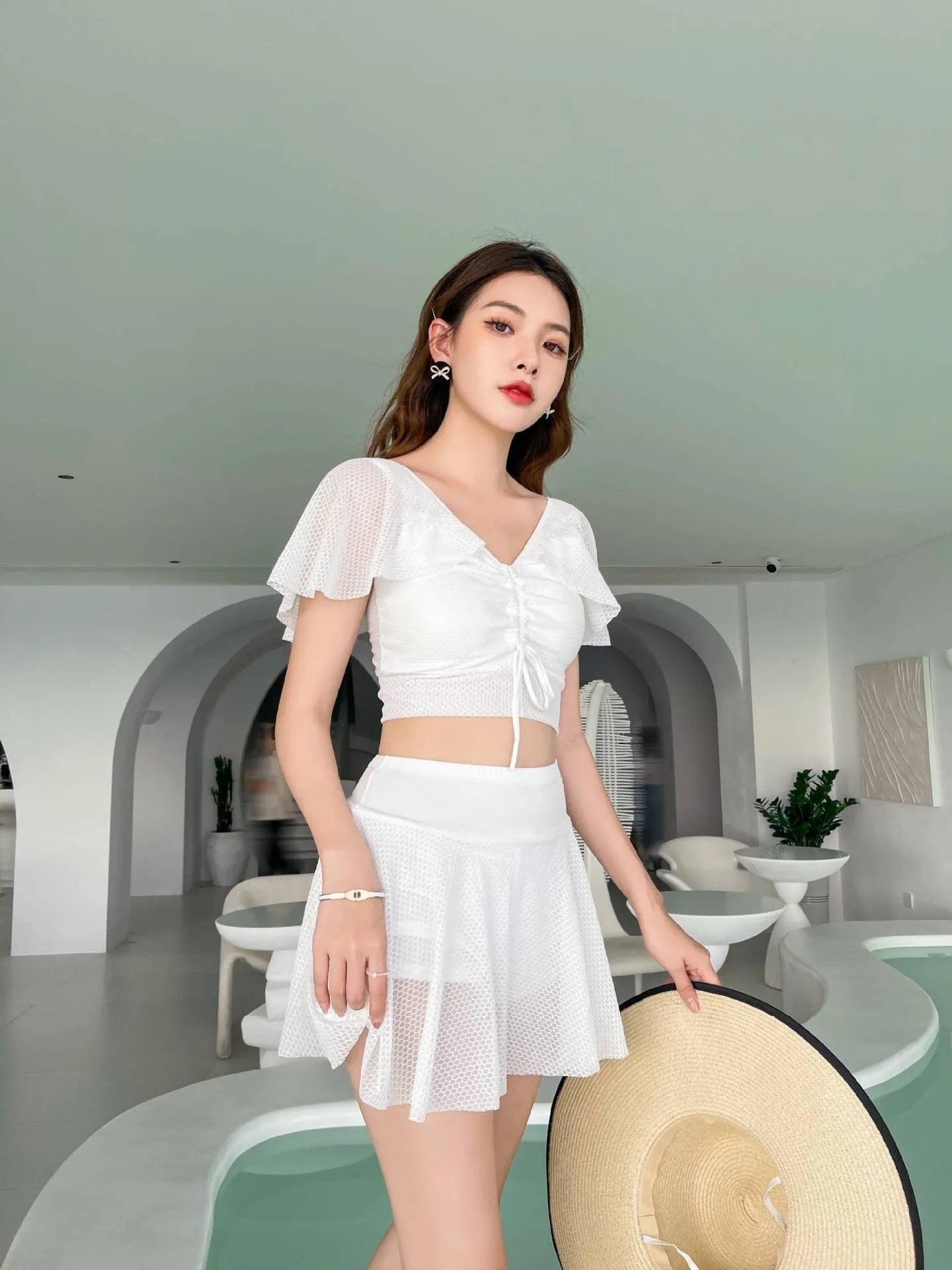 Women's solid colour two-piece skirt swimsuit in polyester and spandex fabric