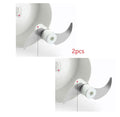 White and silver manual food chopper with stainless steel blades on a kitchen countertop.