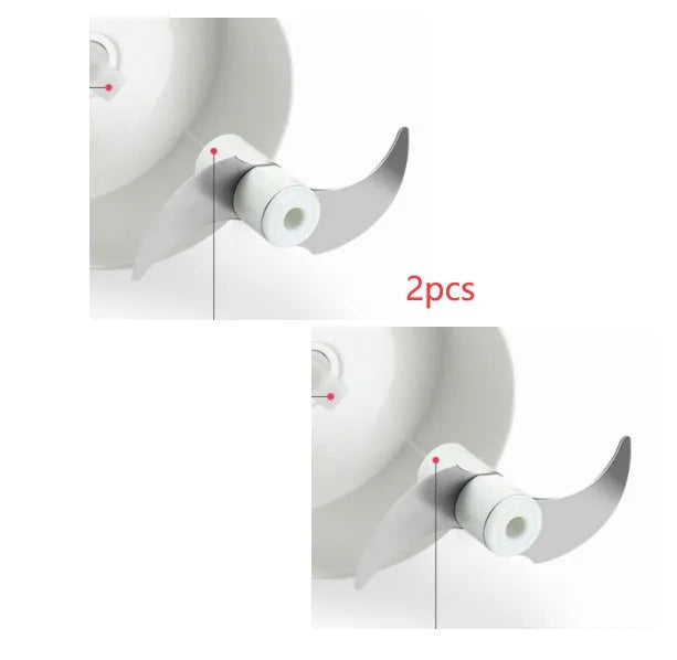 White and silver manual food chopper with stainless steel blades on a kitchen countertop.