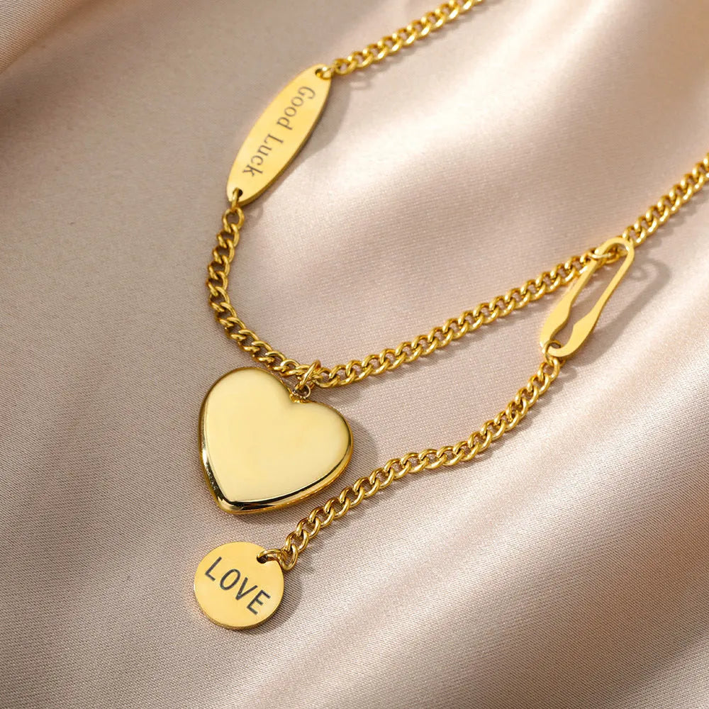 Multilayer heart pendant necklace with moon and star zircon accents on copper O-ring chain