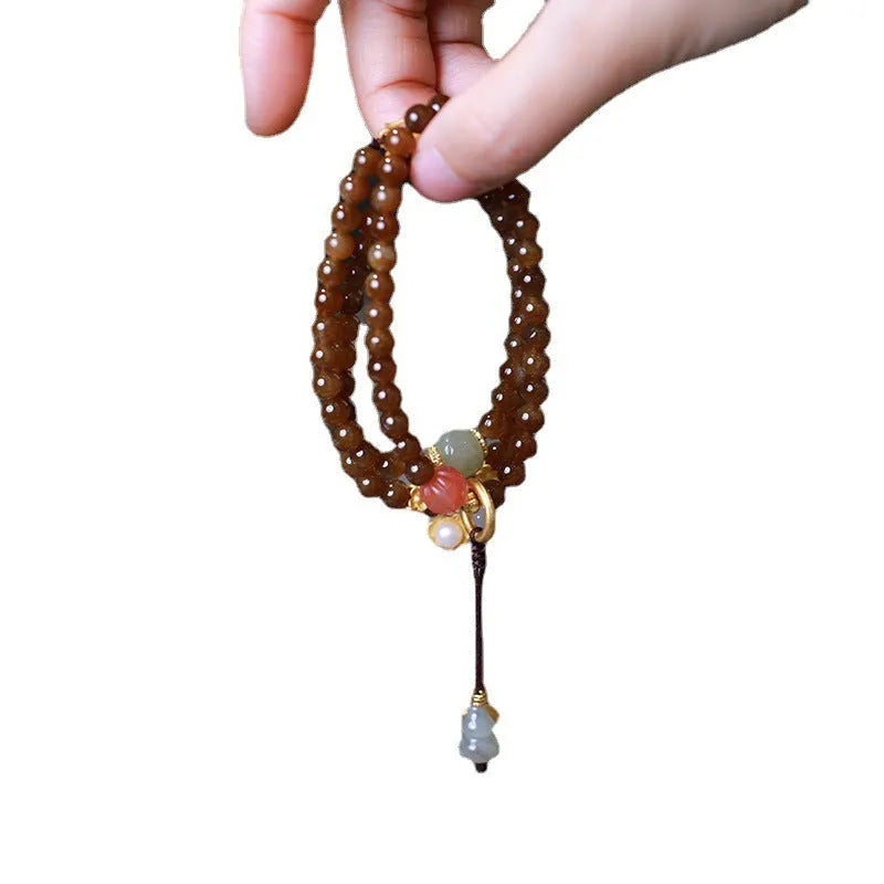 Brown jade Hetian jade three-ring bracelet with silver plated accessories, butterfly and gourd pearl motifs