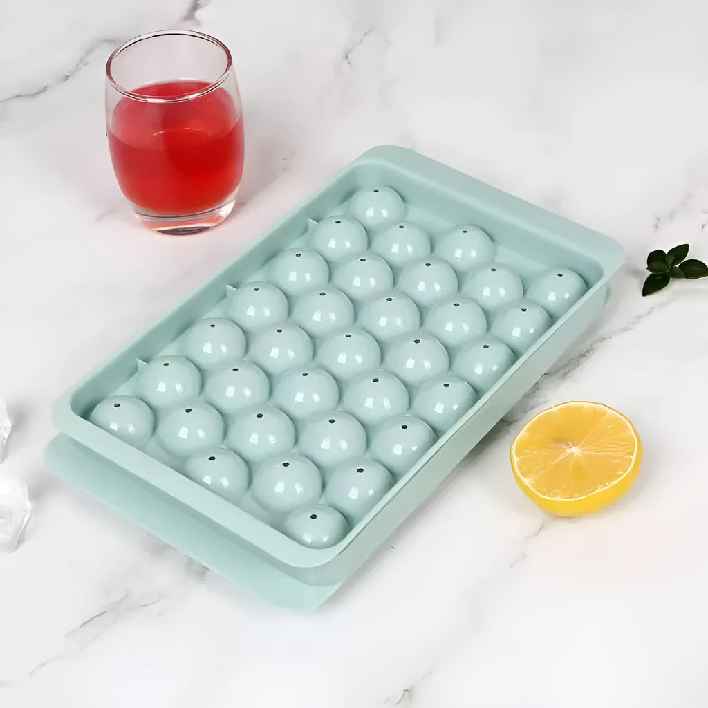 Blue round silicone ice cube tray with lid showing 33 mould cavities