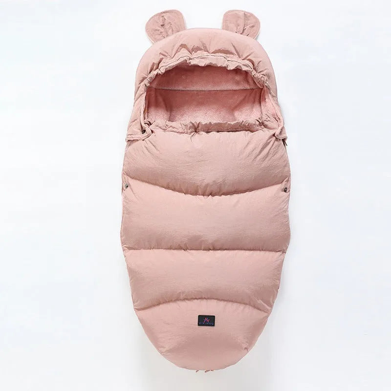 Convertible baby sleeping bag cocoon in a pram, showing cotton blend fabric and flannel lining.