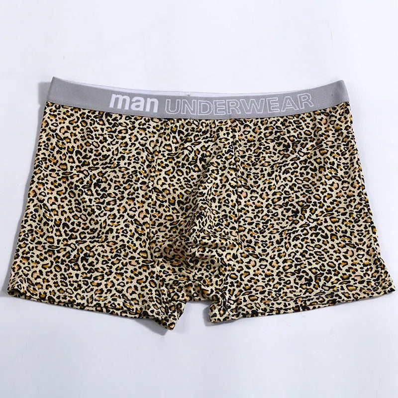 Men's loose fit leopard print underwear in grey and yellow, showing mid-waist design and soft fabric texture.